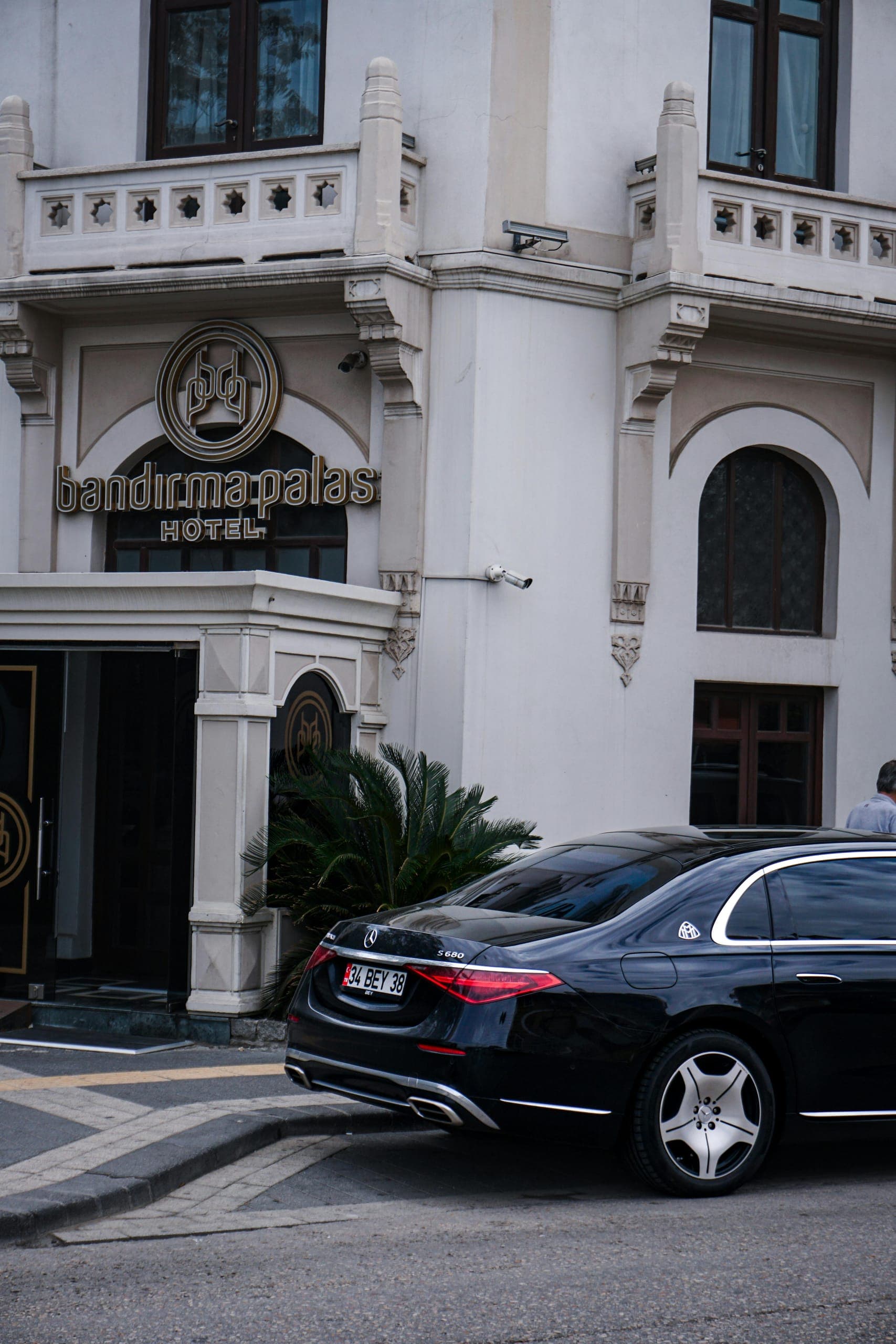Mercedes S-Class waiting outside a boutique hotel entrance